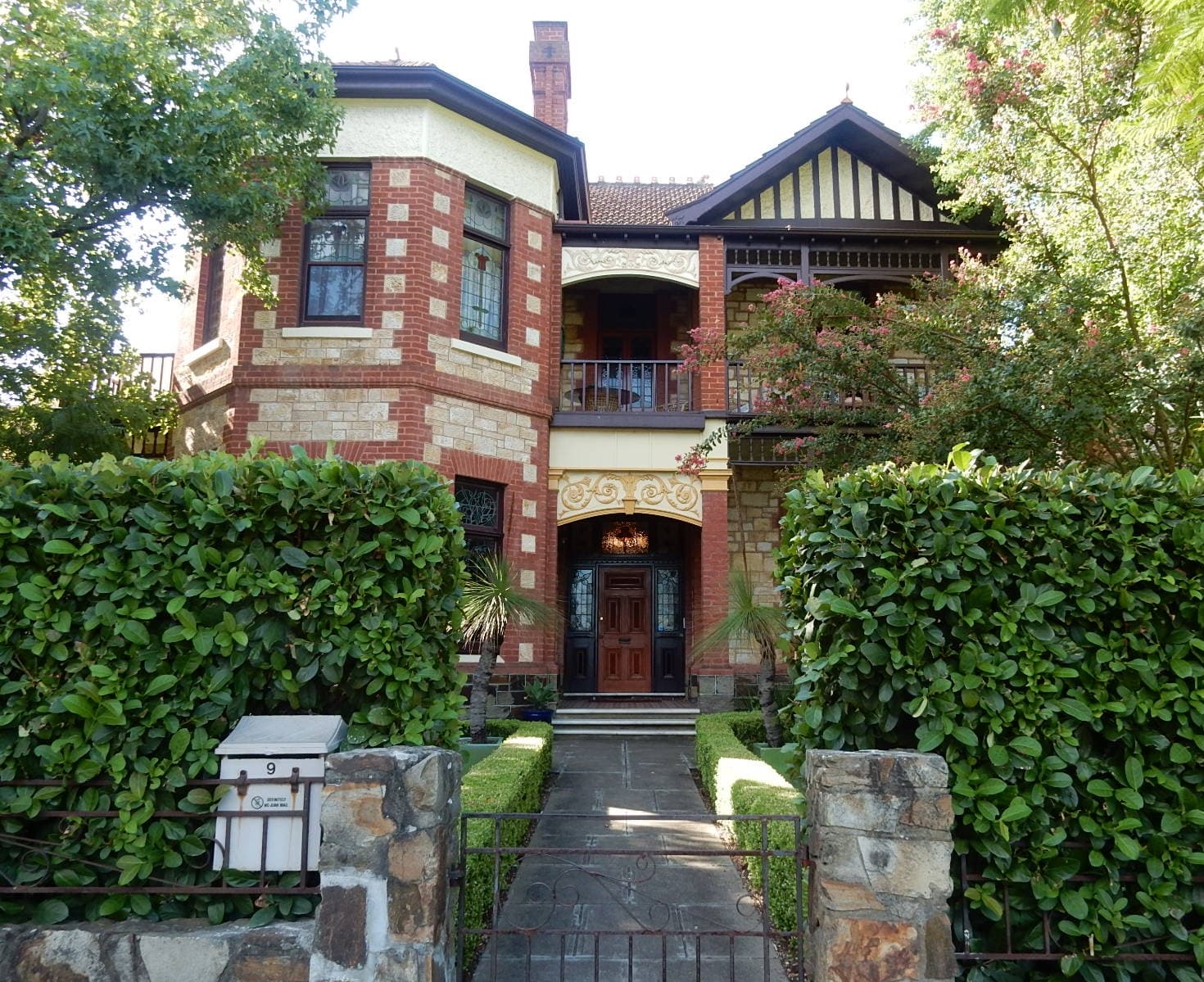 A sandstone mansion with deep verandahs photographed in Adelaide