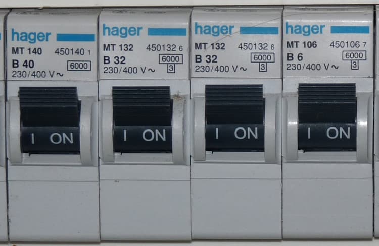 Close-up of labelled circuit breakers in a domestic switchboard